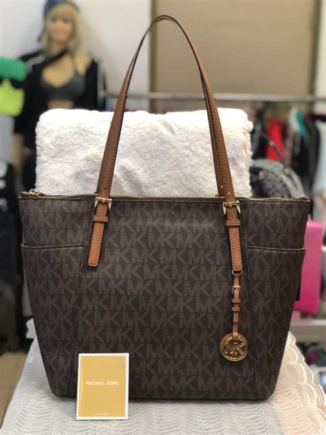 bolsa carteiro michael kors usada